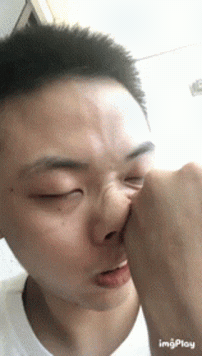 A Close Up Of A Person 'S Face With The Word Imgplay Visible GIF