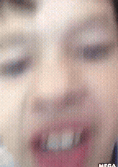 A Close Up Of A Person 'S Face With The Word Mega On The Bottom Right GIF