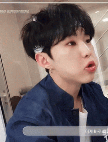 A Close Up Of A Person 'S Face With The Word Seventeen Visible GIF