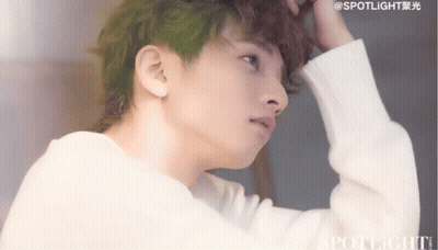 A Close Up Of A Person 'S Face With The Word Spotlight On The Bottom Right GIF