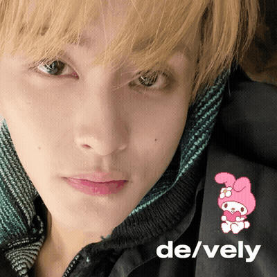 A Close Up Of A Person 'S Face With The Words De / Vely On The Bottom GIF