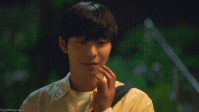 A Close Up Of A Person 'S Face With The Words Dryed Mangoes.com Visible GIF