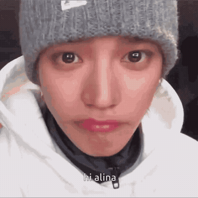 A Close Up Of A Person 'S Face With The Words Hi Alina Written On It GIF