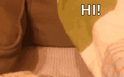 A Close Up Of A Person 'S Face With The Words Hi Written On The Bottom GIF