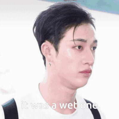 A Close Up Of A Person 'S Face With The Words `` It Was A Wet One '' Written On The Bottom . GIF