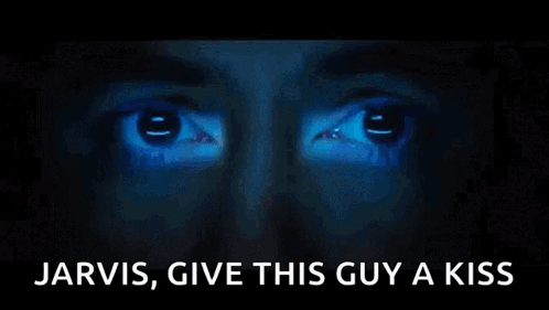 A Close Up Of A Person 'S Face With The Words Jarvis Give This Guy A Kiss Written Below It GIF