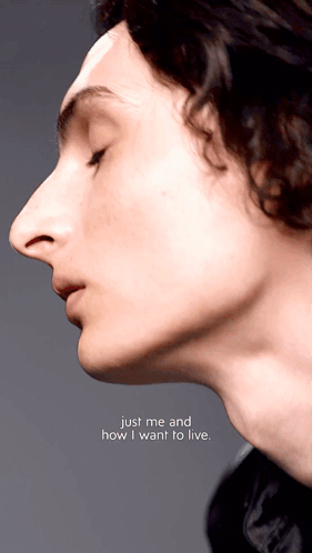 A Close Up Of A Person 'S Face With The Words Just Me And How I Want To Live GIF