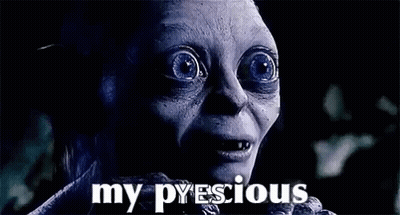 A Close Up Of A Person 'S Face With The Words `` My Precious '' Written On The Bottom . GIF