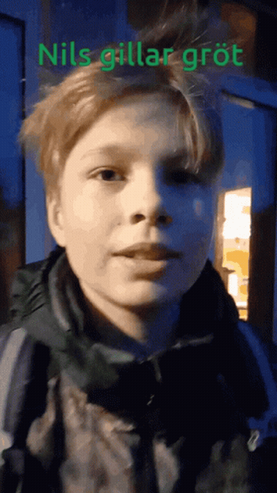 A Close Up Of A Person 'S Face With The Words " Nils Gillar Grot " On The Bottom GIF