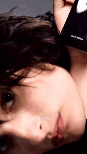 A Close Up Of A Person 'S Face With The Words " No Rules " On The Bottom Right GIF