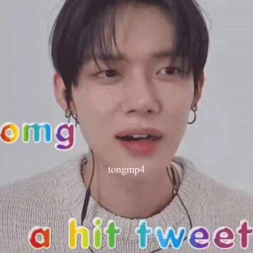 A Close Up Of A Person 'S Face With The Words " Omg A Hit Tweet " Above It GIF