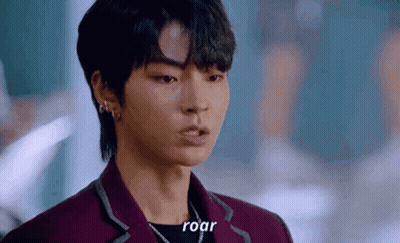 A Close Up Of A Person 'S Face With The Words `` Roar '' Written On The Bottom . GIF