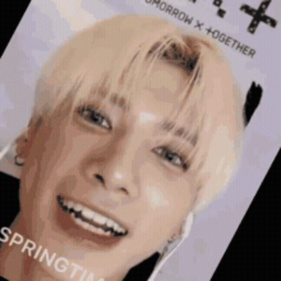 A Close Up Of A Person 'S Face With The Words Tomorrow X + Together On It . GIF
