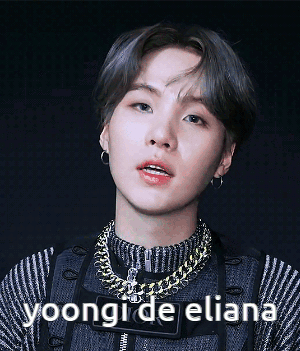 A Close Up Of A Person 'S Face With The Words Yoongi De Eliana Below It GIF