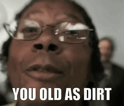 A Close Up Of A Person 'S Face With The Words " You Old As Dirt " On It GIF