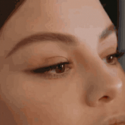 A Close Up Of A Person 'S Face With Their Eyes Closed . GIF