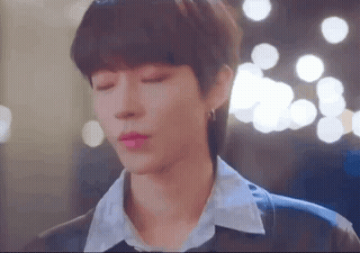 A Close Up Of A Person 'S Face With Their Eyes Closed And A Blurry Background . GIF