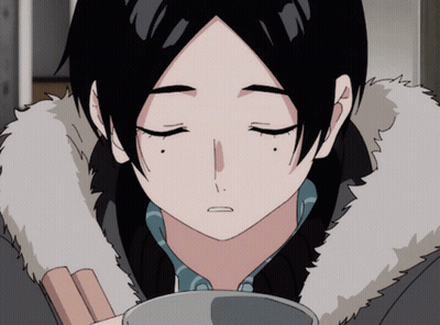 A Close Up Of A Person 'S Face With Their Eyes Closed And A Fur Collar GIF