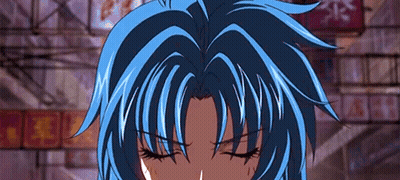 A Close Up Of A Person 'S Face With Their Eyes Closed And Blue Hair . GIF