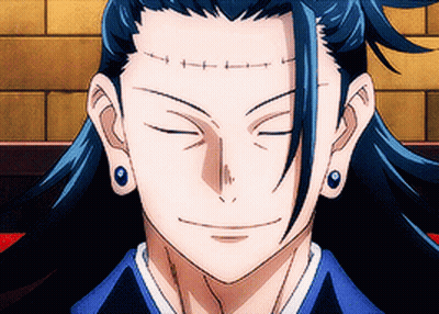 A Close Up Of A Person 'S Face With Their Eyes Closed And Earrings On . GIF