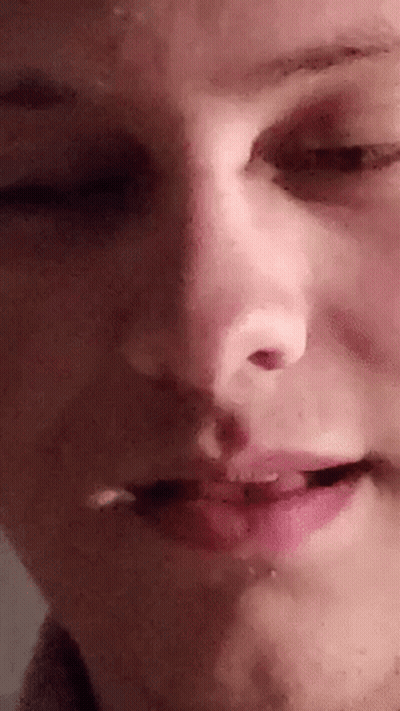 A Close Up Of A Person 'S Face With Their Eyes Closed And Mouth Open . GIF