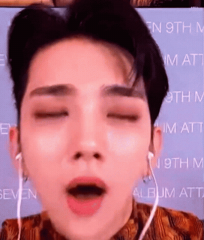 A Close Up Of A Person 'S Face With Their Eyes Closed And Their Mouth Open . GIF
