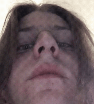 A Close Up Of A Person 'S Face With Their Eyes Closed And Their Nose Visible . GIF