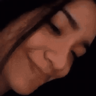 A Close Up Of A Person 'S Face With Their Eyes Closed . GIF