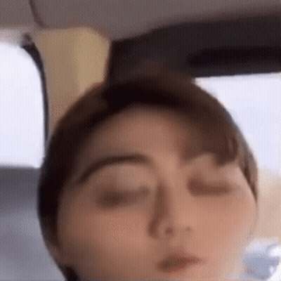 A Close Up Of A Person 'S Face With Their Eyes Closed . GIF
