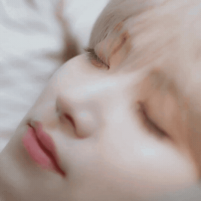 A Close Up Of A Person 'S Face With Their Eyes Closed . GIF