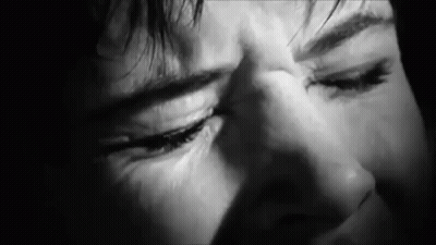 A Close Up Of A Person 'S Face With Their Eyes Closed . GIF