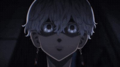 A Close Up Of A Person 'S Face With Their Eyes Glowing In The Dark GIF