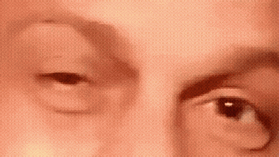 A Close Up Of A Person 'S Face With Their Eyes Open . GIF