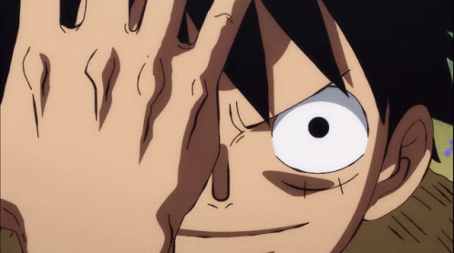 A Close Up Of A Person 'S Face With Their Hand Covering Their Eyes GIF
