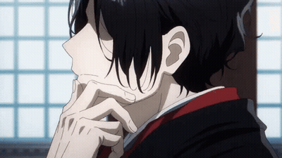 A Close Up Of A Person 'S Face With Their Hand On Their Chin . GIF