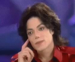 A Close Up Of A Person 'S Face With Their Hand On Their Ear . GIF
