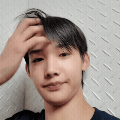 A Close Up Of A Person 'S Face With Their Hand On Their Forehead GIF