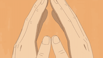 A Close Up Of A Person 'S Face With Their Hands Folded In Front Of Their Face . GIF