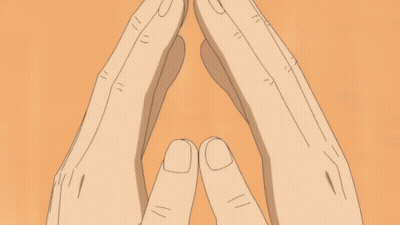 A Close Up Of A Person 'S Face With Their Hands Folded GIF