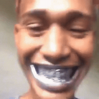 A Close Up Of A Person 'S Face With Their Mouth Open And A Toothbrush In It . GIF