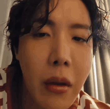 A Close Up Of A Person 'S Face With Their Mouth Open And Their Eyes Closed . GIF