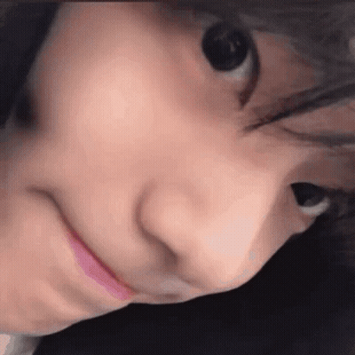 A Close Up Of A Person 'S Face With Their Mouth Open And Their Eyes Closed . GIF