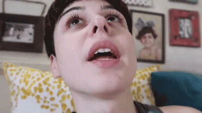A Close Up Of A Person 'S Face With Their Mouth Open And Their Teeth Visible . GIF