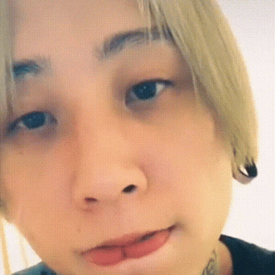 A Close Up Of A Person 'S Face With Their Mouth Open And Their Tongue Out . GIF