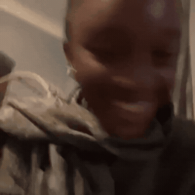 A Close Up Of A Person 'S Face With Their Mouth Open GIF