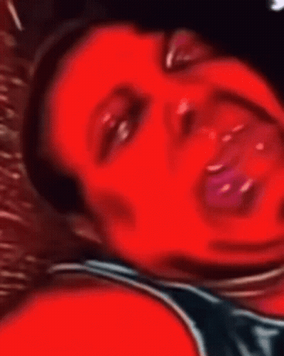 A Close Up Of A Person 'S Face With Their Mouth Open GIF
