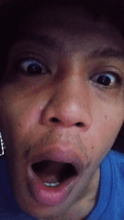 A Close Up Of A Person 'S Face With Their Mouth Wide Open GIF