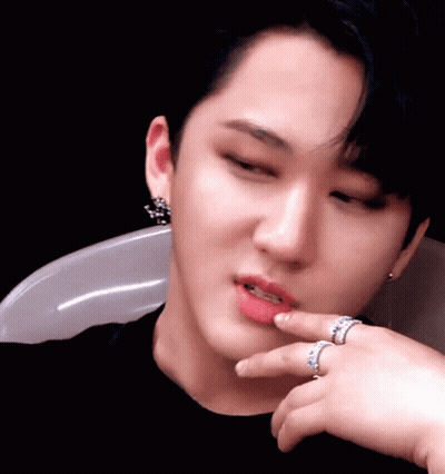 A Close Up Of A Person 'S Face With Two Rings On Their Finger GIF
