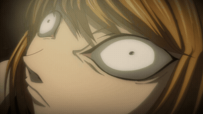 A Close Up Of A Person 'S Face With White Eyes And A Black Spot In The Middle GIF