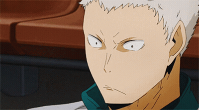 A Close Up Of A Person 'S Face With White Hair And A Green Shirt GIF